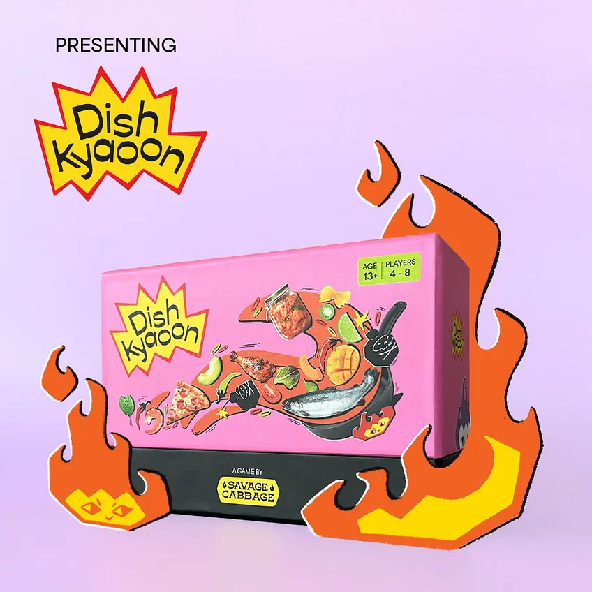 The pink Dish Kyaoon box, illustrated with food and flames, for four to eight players aged thirteen and above.